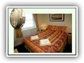 (Room 5) A double room located at the rear of the property on the first floor with full en-suite shoer room.