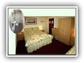 (Room 7) Family / twin room located at the rear of the property on the first floor with en-suite shower and toilet.